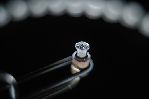 Polished diamonds with De Beers Group Industry Services grading